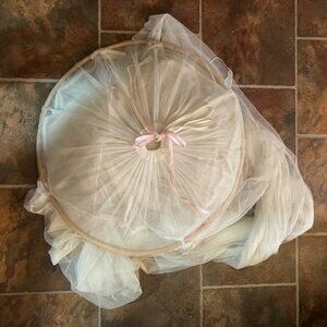 Bed canopy with CANE hoop 23"diam /a pink bow on top - lt. cream , pre-owned